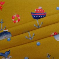 Kids-Jerseystoff-goldfärbig-mit-Marine-Motiven